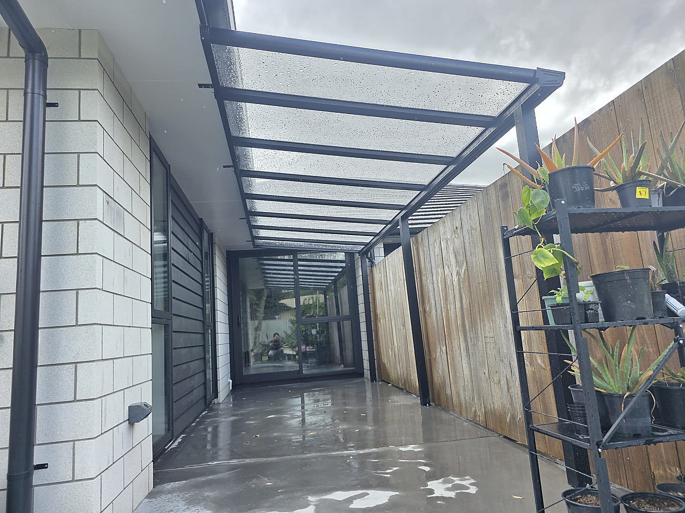 Curved black canopy over deck