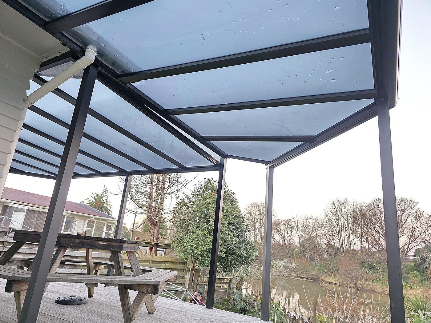 Polycarbonate canopy over timber deck
