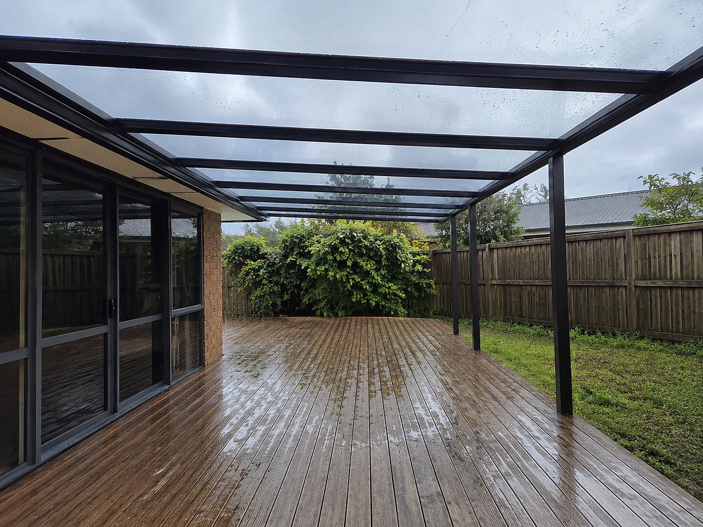 Wide canopy over deck in rain